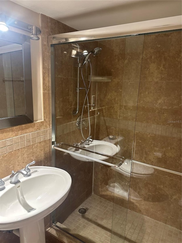 10355 Paradise Blvd Unit 907, Treasure Island, FL 33706 - bathroom with a sink and a shower stall