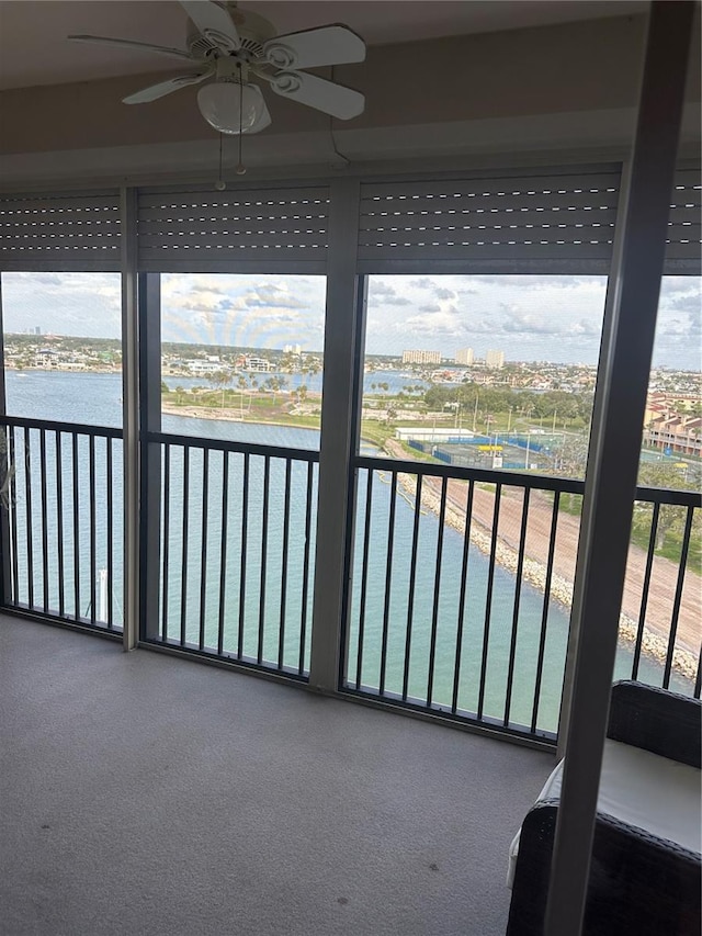 10355 Paradise Blvd Unit 907, Treasure Island, FL 33706 - unfurnished sunroom with a water view
