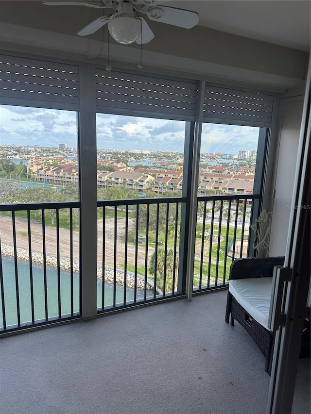 10355 Paradise Blvd Unit 907, Treasure Island, FL 33706 - sunroom featuring a ceiling fan, healthy amount of natural light, and a city view