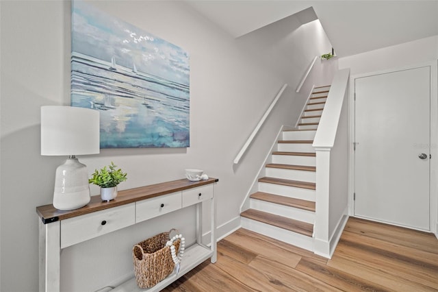 616 Garland Cir, Indian Rocks Beach, FL 33785 - staircase featuring wood finished floors and baseboards