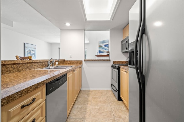 616 Garland Cir, Indian Rocks Beach, FL 33785 - kitchen with stainless steel appliances, a sink, baseboards, light brown cabinets, and recessed lighting