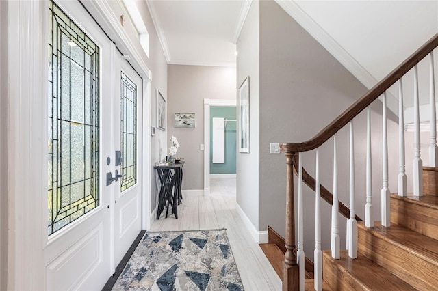 24197 Treasure Island Blvd, Punta Gorda, FL 33955 - entryway with crown molding, stairs, and light wood-type flooring