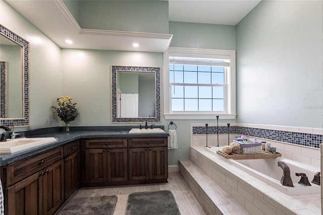 24197 Treasure Island Blvd, Punta Gorda, FL 33955 - full bath with double vanity, a bath, and wood finished floors
