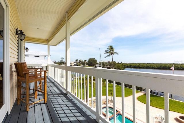 24197 Treasure Island Blvd, Punta Gorda, FL 33955 - balcony featuring a water view, a pool with connected hot tub, and view of pool area
