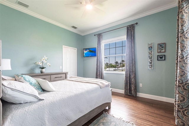 24197 Treasure Island Blvd, Punta Gorda, FL 33955 - bedroom with wood-type flooring, crown molding, a ceiling fan, and a closet