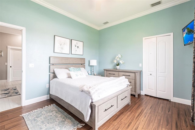 24197 Treasure Island Blvd, Punta Gorda, FL 33955 - bedroom featuring crown molding, wood finished floors, a closet, and a ceiling fan
