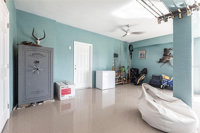 24197 Treasure Island Blvd, Punta Gorda, FL 33955 - garage with a textured wall, refrigerator, and a ceiling fan