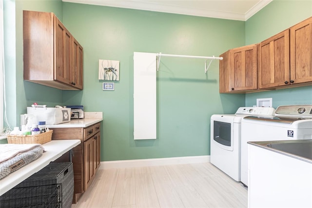 24197 Treasure Island Blvd, Punta Gorda, FL 33955 - laundry room with cabinet space, washing machine and clothes dryer, and ornamental molding
