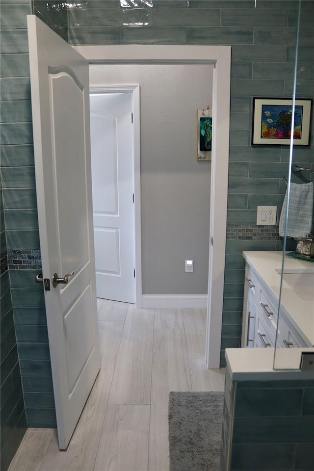 24197 Treasure Island Blvd, Punta Gorda, FL 33955 - bathroom with vanity and tile walls