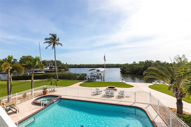 24197 Treasure Island Blvd, Punta Gorda, FL 33955 - view of pool featuring boat lift, a water view, a dock, a patio, and a pool with connected hot tub