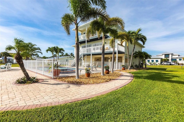 24197 Treasure Island Blvd, Punta Gorda, FL 33955 - back of property with a balcony and a patio