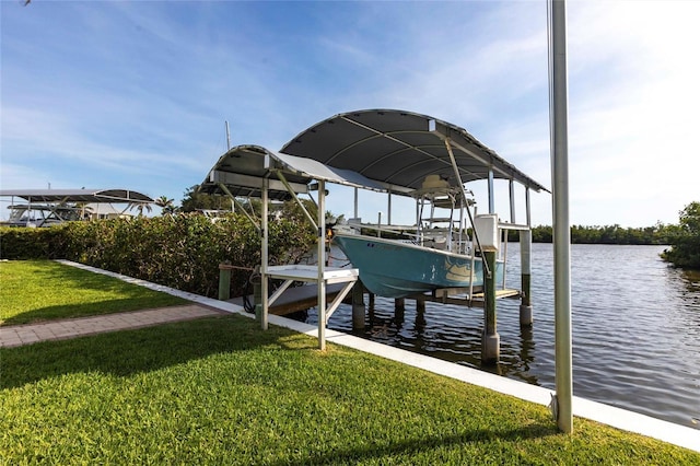 24197 Treasure Island Blvd, Punta Gorda, FL 33955 - dock area with boat lift, a water view, and a lawn