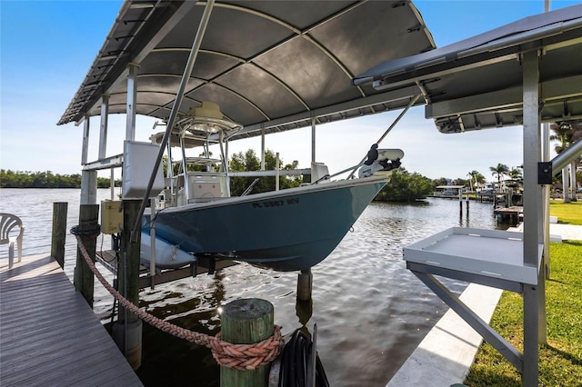 24197 Treasure Island Blvd, Punta Gorda, FL 33955 - dock area featuring boat lift and a water view