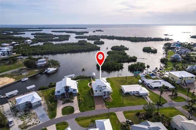 24197 Treasure Island Blvd, Punta Gorda, FL 33955 - aerial perspective of suburban area with a large body of water