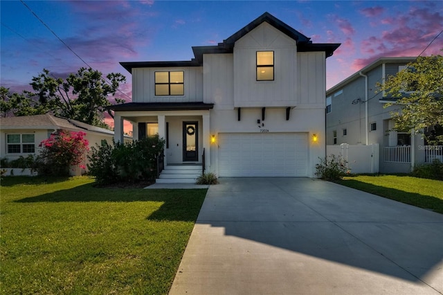 72031/2 S W Shore Blvd, Tampa, FL 33616 - view of front of home featuring a garage, concrete driveway, and board and batten siding