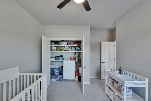 72031/2 S W Shore Blvd, Tampa, FL 33616 - bedroom with carpet flooring, a closet, a ceiling fan, a nursery area, and baseboards