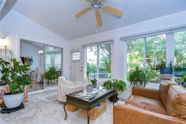 1210 Wolford Dr, Trinity, FL 34655 - carpeted living area with vaulted ceiling, a ceiling fan, and a chandelier