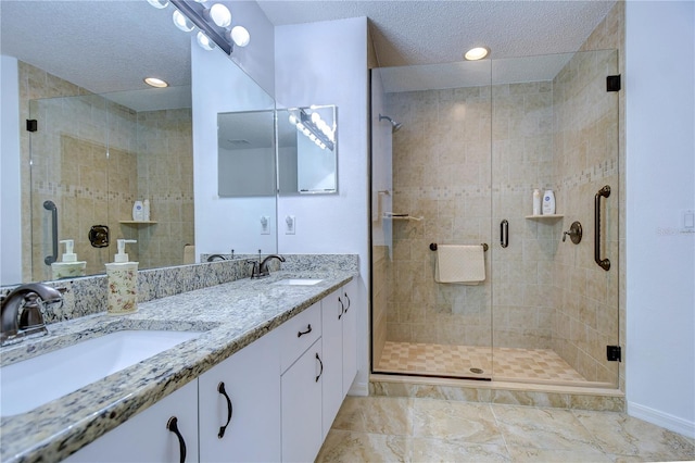 1210 Wolford Dr, Trinity, FL 34655 - full bathroom featuring baseboards, double vanity, a shower stall, a textured ceiling, and recessed lighting