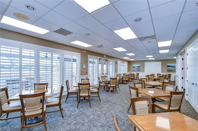 1210 Wolford Dr, Trinity, FL 34655 - dining area featuring carpet floors and a drop ceiling