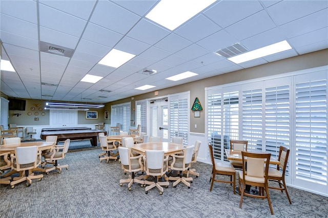 1210 Wolford Dr, Trinity, FL 34655 - carpeted dining room with a paneled ceiling and wainscoting