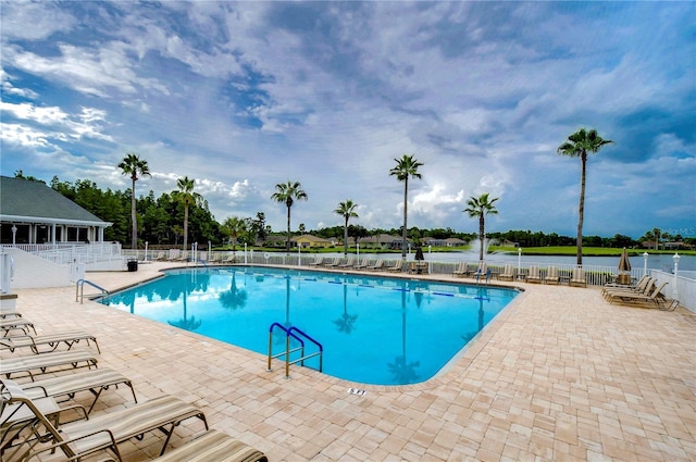 1210 Wolford Dr, Trinity, FL 34655 - community pool featuring a patio area