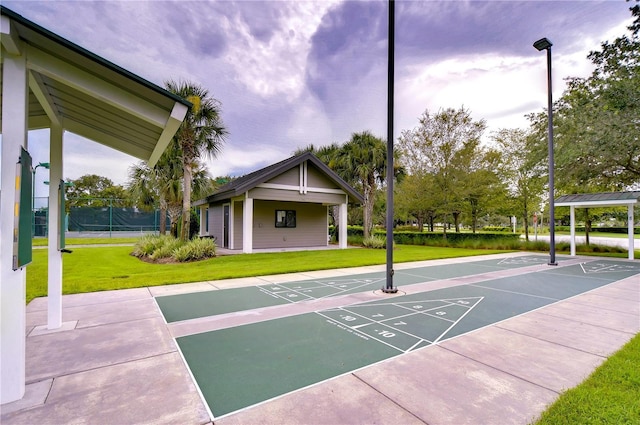 1210 Wolford Dr, Trinity, FL 34655 - view of property's community featuring shuffleboard and a yard