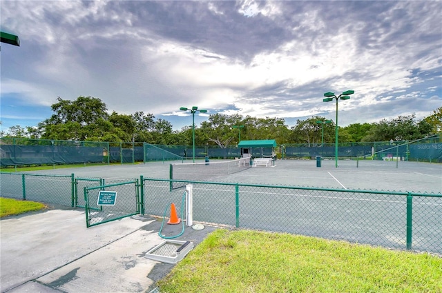 1210 Wolford Dr, Trinity, FL 34655 - view of tennis court featuring a gate