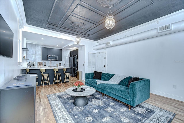 215 Central Ave Unit 2B, Saint Petersburg, FL 33701 - living area with light wood-type flooring and baseboards