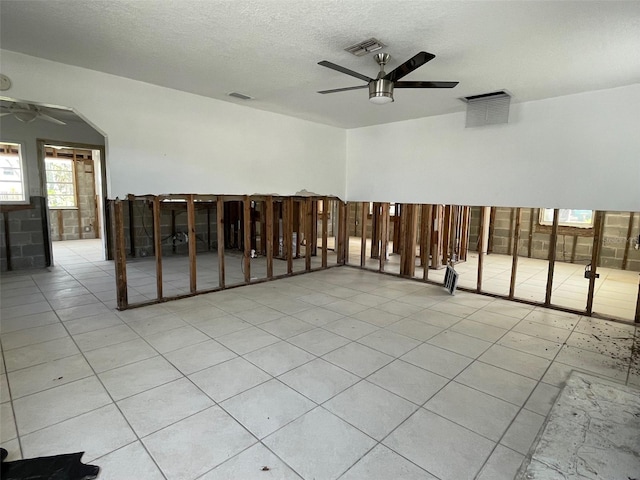 3207 S De Bazan Ave, St Pete Beach, FL 33706 - unfurnished room with ceiling fan and a textured ceiling
