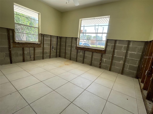 3207 S De Bazan Ave, St Pete Beach, FL 33706 - tiled empty room with ceiling fan