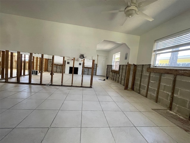 3207 S De Bazan Ave, St Pete Beach, FL 33706 - unfurnished room featuring a ceiling fan, light tile patterned floors, and arched walkways
