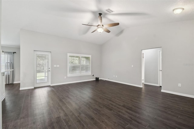 13227 Quigley Ave, Weeki Wachee, FL 34614 - unfurnished living room featuring a ceiling fan, vaulted ceiling, baseboards, and dark wood-style flooring