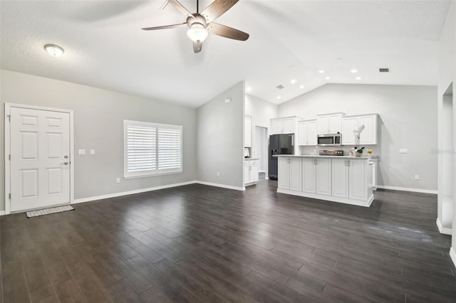 13227 Quigley Ave, Weeki Wachee, FL 34614 - unfurnished living room with ceiling fan, dark wood-type flooring, baseboards, recessed lighting, and high vaulted ceiling