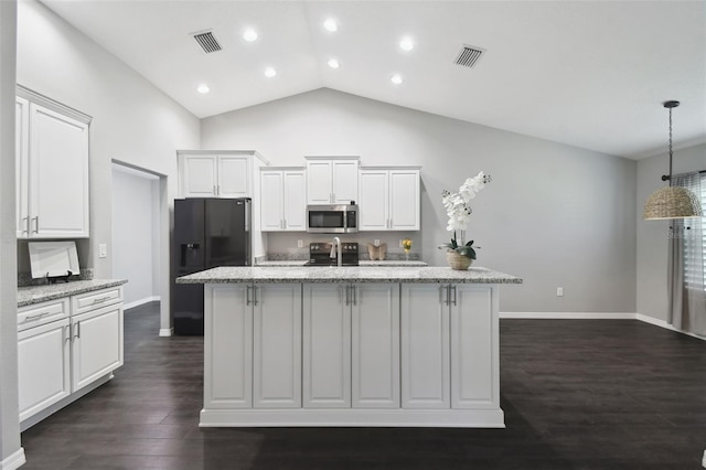 13227 Quigley Ave, Weeki Wachee, FL 34614 - kitchen featuring black appliances, a kitchen island with sink, baseboards, white cabinets, and recessed lighting