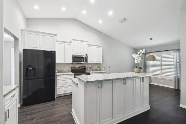 13227 Quigley Ave, Weeki Wachee, FL 34614 - kitchen with black appliances, dark wood-style flooring, an island with sink, white cabinetry, and light stone countertops