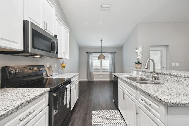 13227 Quigley Ave, Weeki Wachee, FL 34614 - kitchen with black appliances, a sink, white cabinetry, and dark wood-style flooring