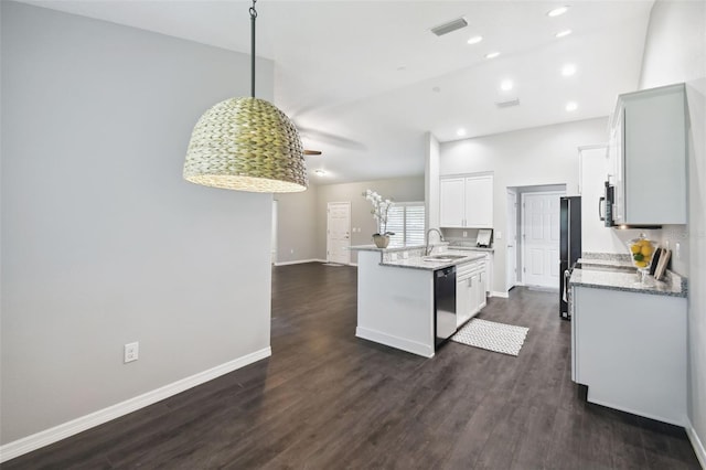 13227 Quigley Ave, Weeki Wachee, FL 34614 - kitchen with black appliances, a sink, dark wood-style floors, light stone counters, and recessed lighting