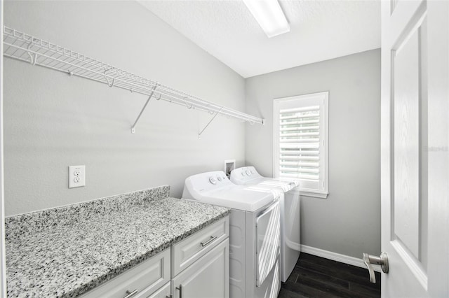 13227 Quigley Ave, Weeki Wachee, FL 34614 - washroom featuring washer and dryer, baseboards, and dark wood-style flooring
