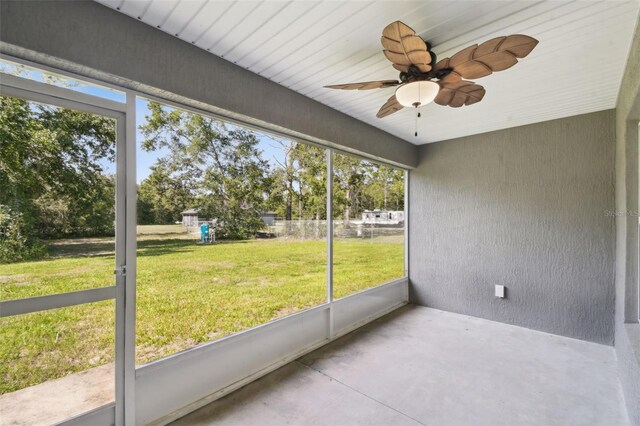 13227 Quigley Ave, Weeki Wachee, FL 34614 - unfurnished sunroom with ceiling fan