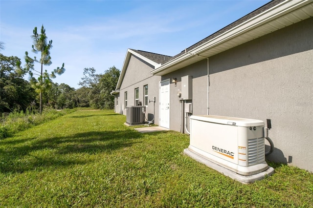 13227 Quigley Ave, Weeki Wachee, FL 34614 - view of green lawn with central AC unit