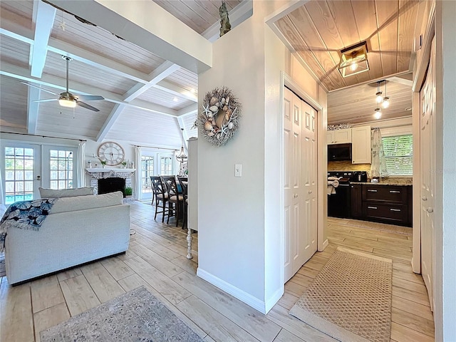 1445 Stonehenge Way, Palm Harbor, FL 34683 - corridor featuring wood ceiling with exposed beams, light wood finished floors, baseboards, and french doors