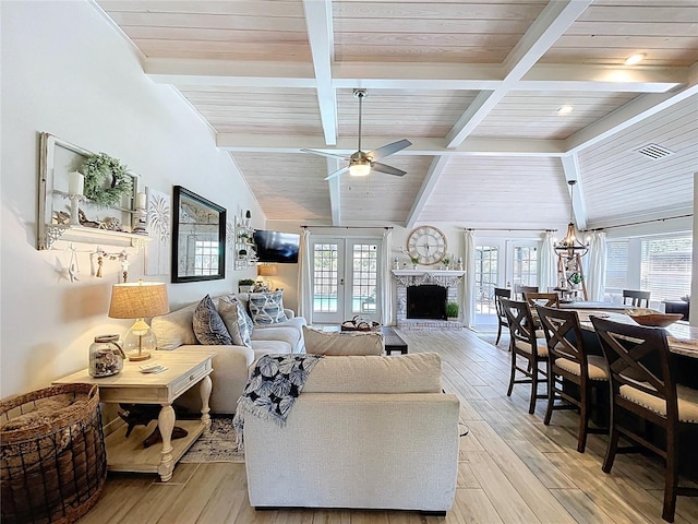 1445 Stonehenge Way, Palm Harbor, FL 34683 - living area with french doors, wood ceiling, light wood-style floors, and healthy amount of natural light