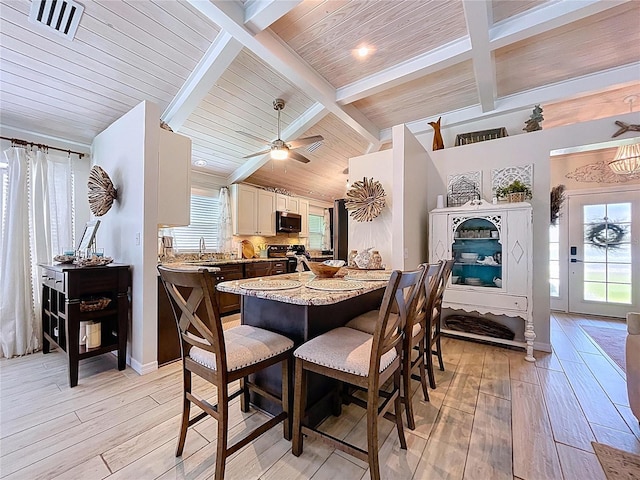 1445 Stonehenge Way, Palm Harbor, FL 34683 - dining area featuring light wood finished floors, a ceiling fan, and wood ceiling
