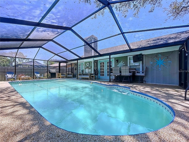 1445 Stonehenge Way, Palm Harbor, FL 34683 - view of swimming pool featuring french doors, a patio, and glass enclosure