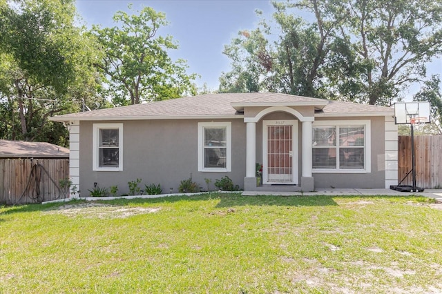8517 N Branch Ave, Tampa, FL 33604 - single story home with stucco siding and roof with shingles