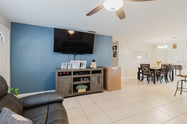 8517 N Branch Ave, Tampa, FL 33604 - living room with ceiling fan, a chandelier, light tile patterned floors, and baseboards