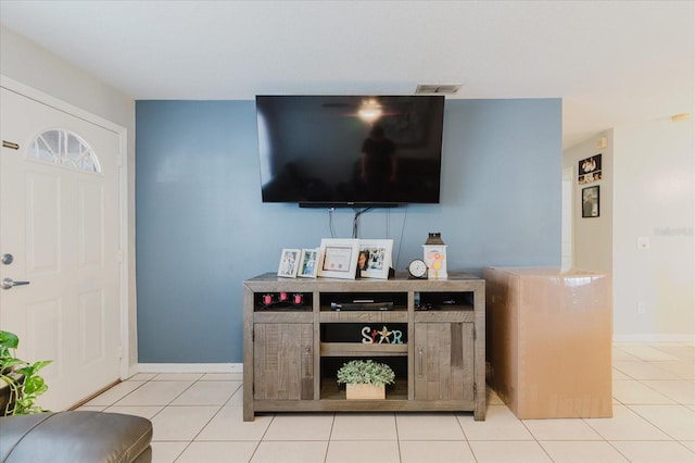 8517 N Branch Ave, Tampa, FL 33604 - living area with light tile patterned floors and baseboards