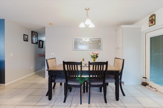 8517 N Branch Ave, Tampa, FL 33604 - dining room featuring a chandelier and light tile patterned flooring