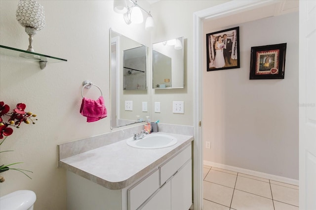 8517 N Branch Ave, Tampa, FL 33604 - bathroom with vanity, toilet, and tile patterned flooring