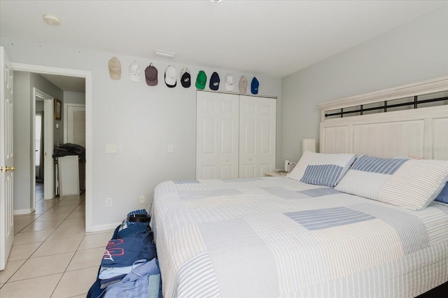 8517 N Branch Ave, Tampa, FL 33604 - bedroom with light tile patterned floors, a closet, and baseboards